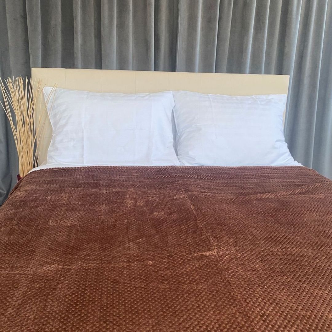 Medium brown polka dot bedspread